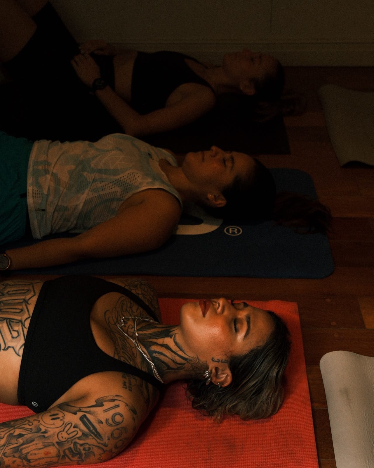 Koti guests meditating and breathing in the outdoor cold-plunge courtyard