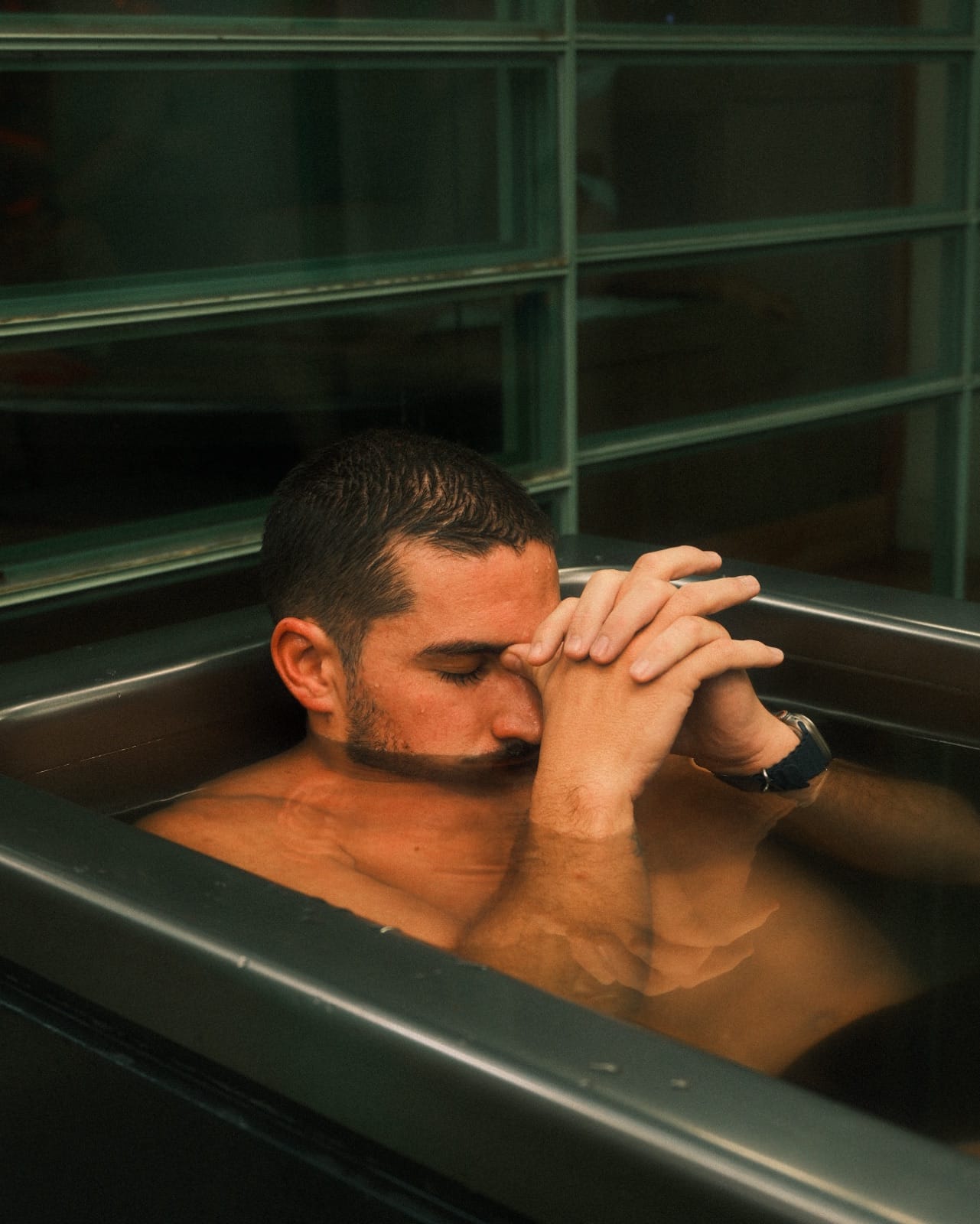 Guest breathing steadily in a Koti cold plunge